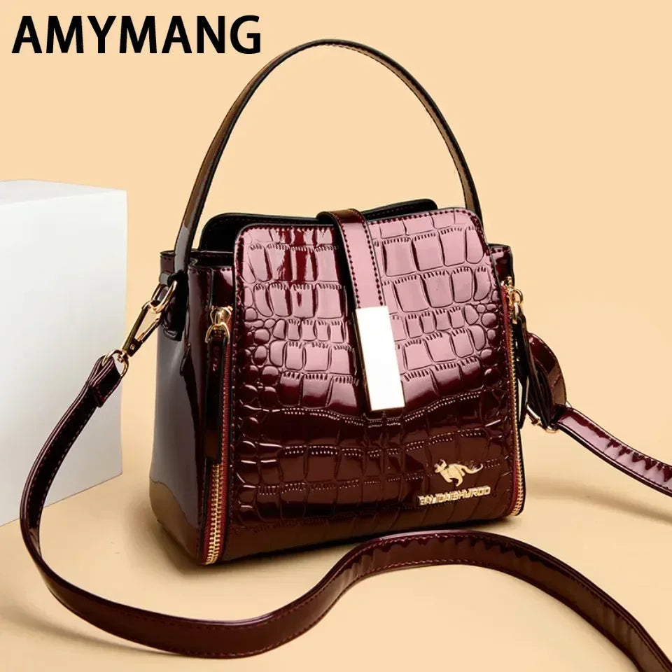 Sac à main en cuir verni pour femmes, sac seau en cuir de haute qualité avec poche intérieure, sac à bandoulière de marque de luxe pour femmes.